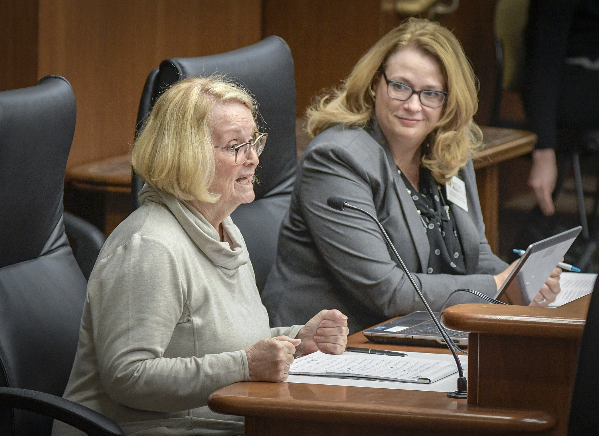 Judy Marder, left, of the Best Life Alliance, testifies before the House Health and Human Services Policy Committee Feb. 11 in support of a bill sponsored by Rep. Laurie Halverson, right, to modify the disability waiver rate system. Photo by Andrew VonBank
